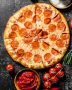 Pepperoni pizza with tomatoes, spices